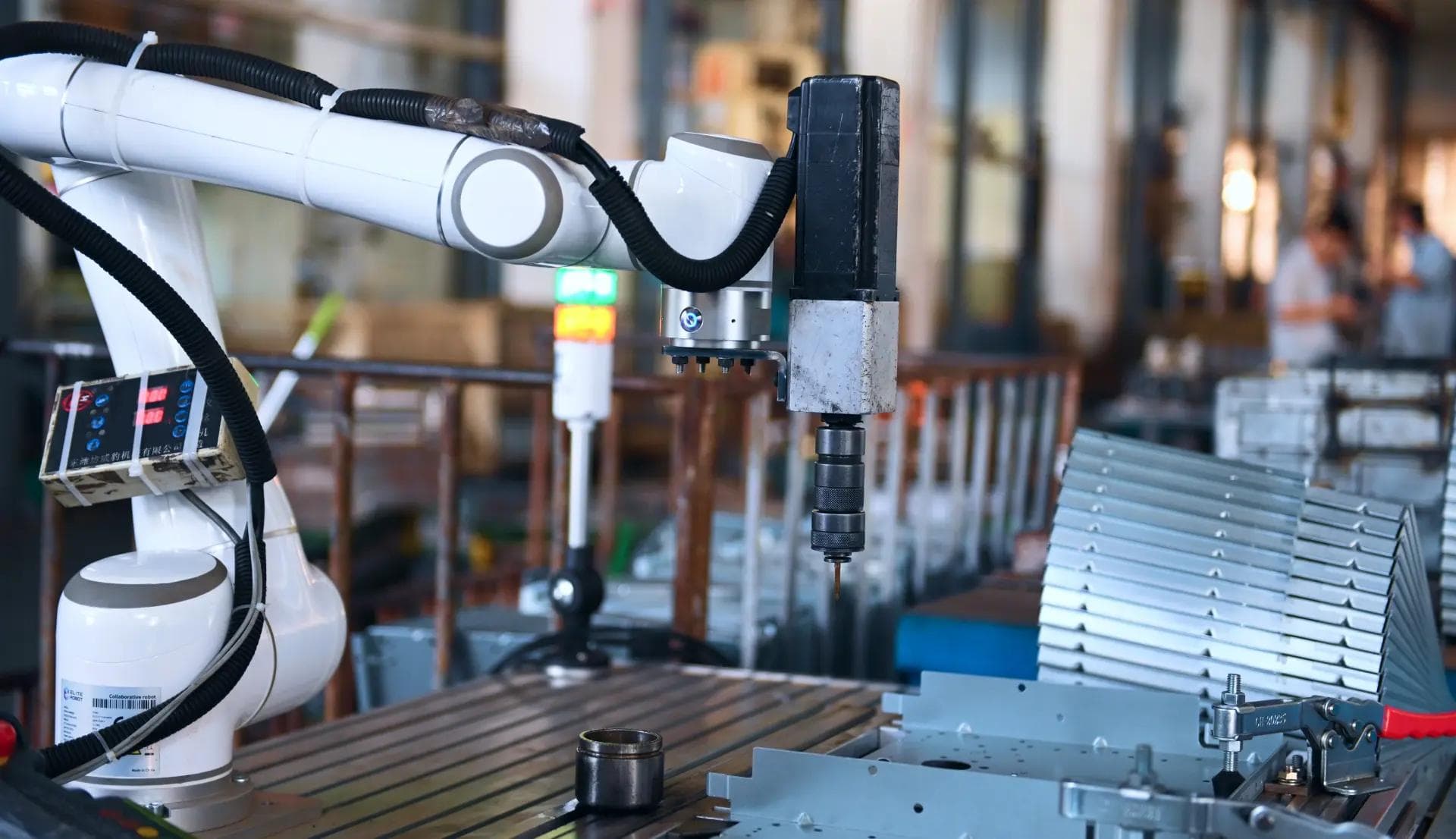 Collaborative robot performing precision assembly and screwdriving task