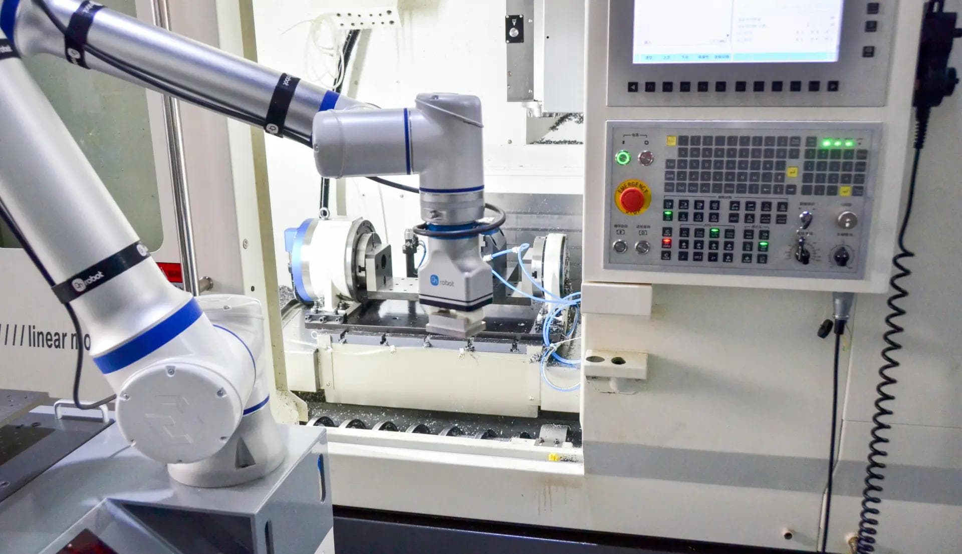 Cobot loading parts into CNC machine for automated machine tending