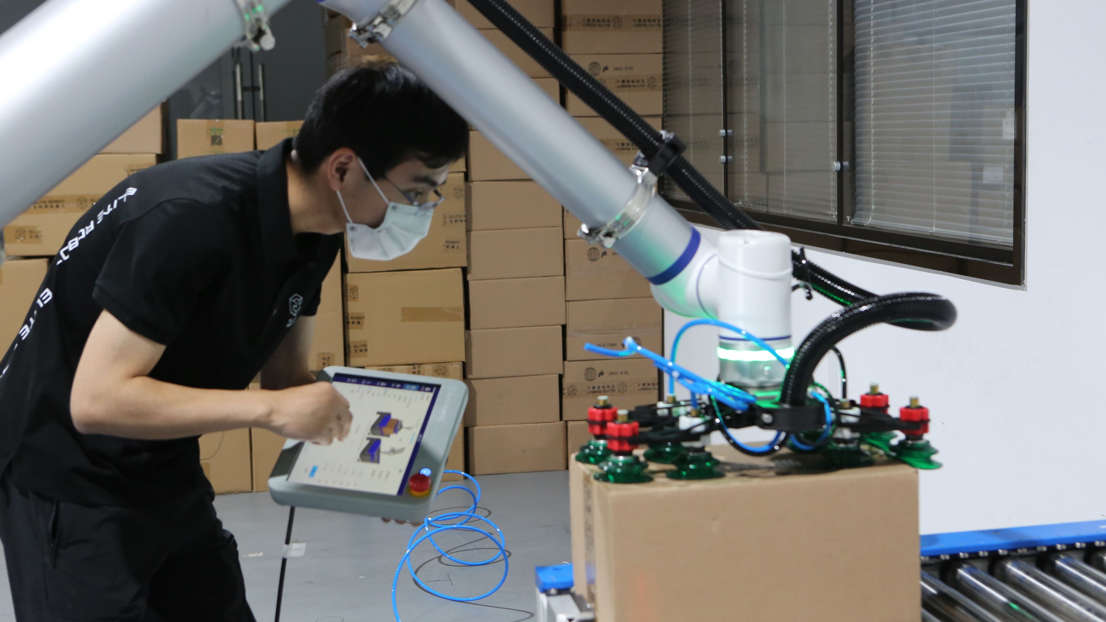 Collaborative robot in educational setting demonstrating inspection and quality control