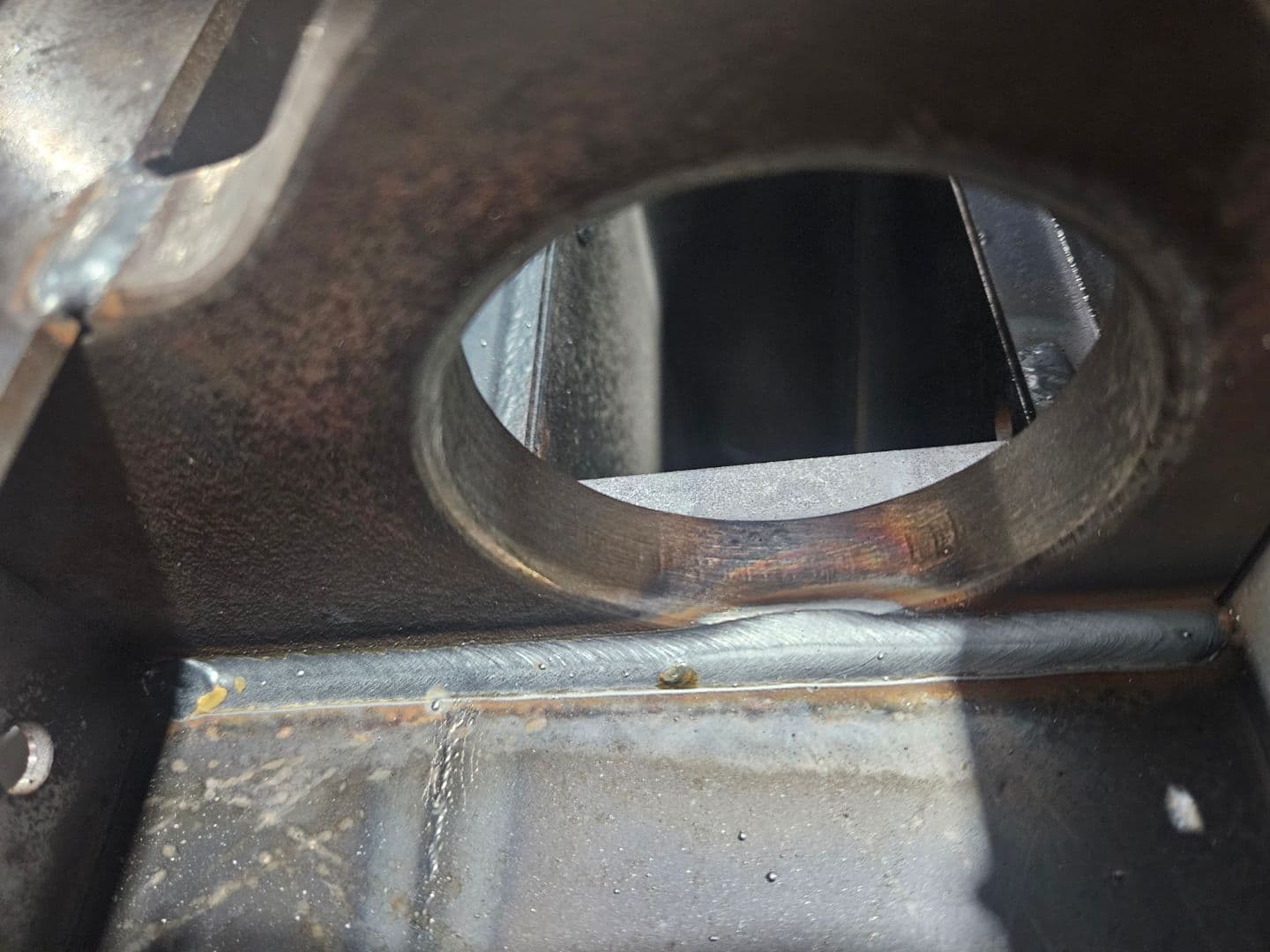 Close-up of finished weld bead around a circular port